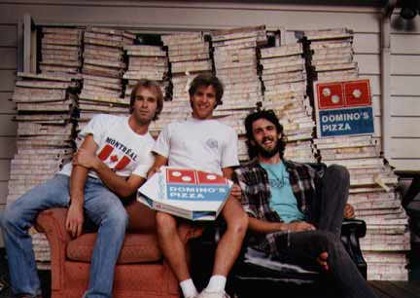 pizza party! EBA in front of a ridiculous number of empty pizza boxes